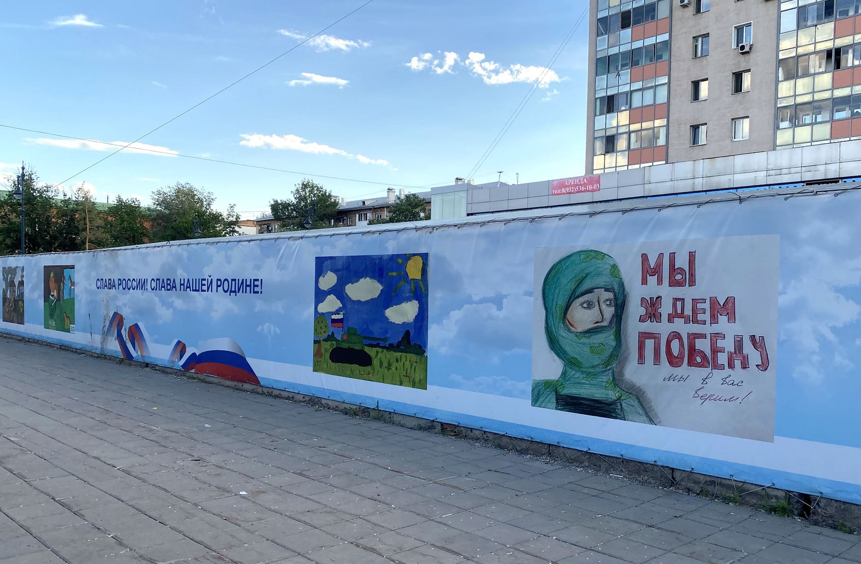 A wall of “patriotic” children's paintings in Orenburg