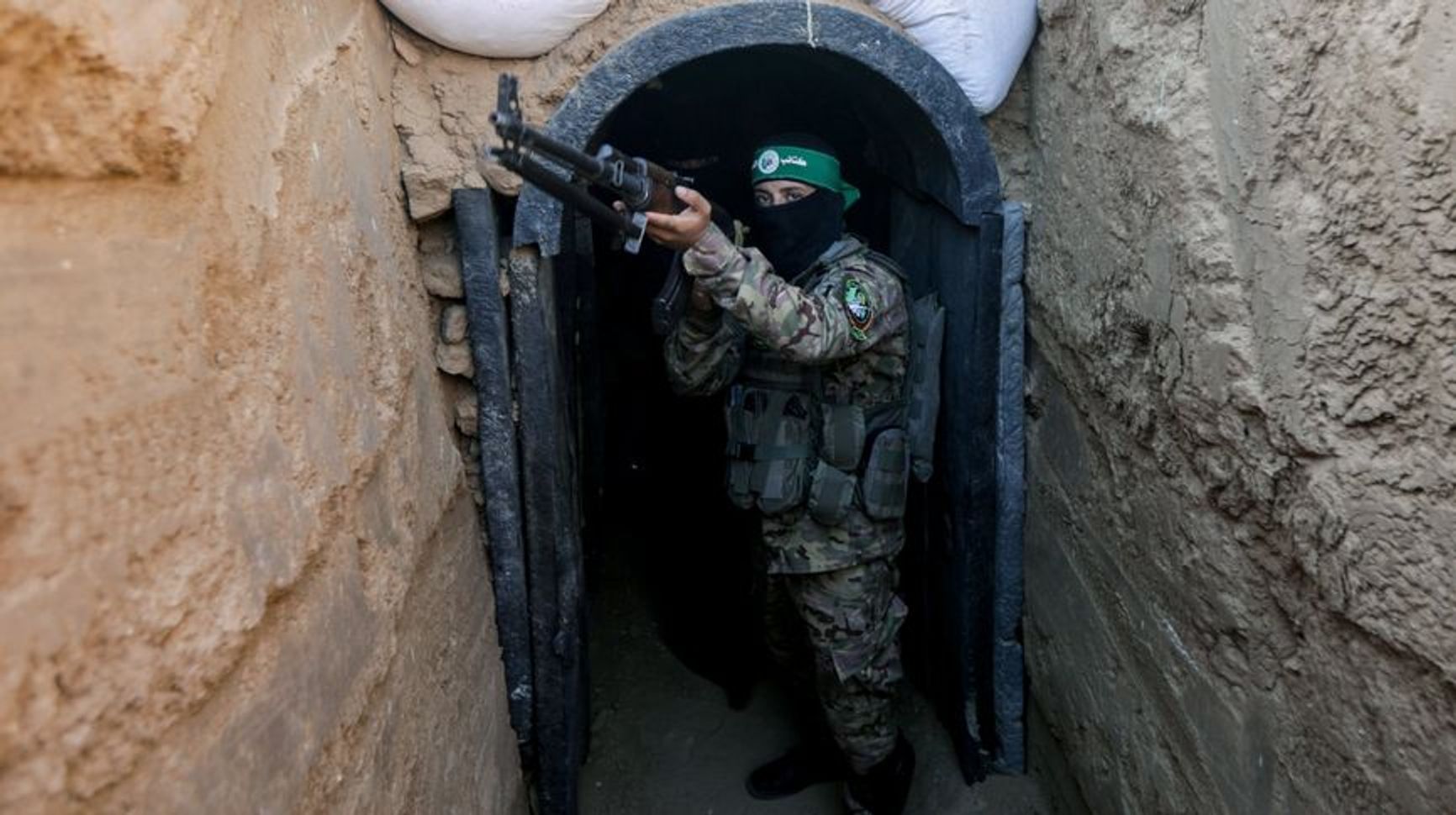 A Palestinian fighter at one of the entrances to the so-called 'Gaza Metro'